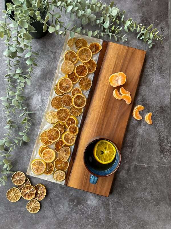 Dried lemon and lime resin charcuterie board, chopping board, celestial decor, pagan decor, boho decor, witchy decor, mystical decor, chic home decor, bookshelf decor, hostess gift ideas, dark academia, contemporary art, collector, collectible art, interior design, new homeowner gift, housewarming gift, New home gift, wedding party gift, Charcuterie board, wood serving board, epoxy resin art, geode art, resin tray, resin cutting board, wood chopping board, walnut cutting board, wooden serving board, gift for sister, nature lovers gift, charcuterie board, decorative board, resin pine cone, walnut wood tray, dark green epoxy, functional art, kitchen accessories, rustic decor, pine cone decor, wooden serving tray, gift for mentor, gift for bestfriend